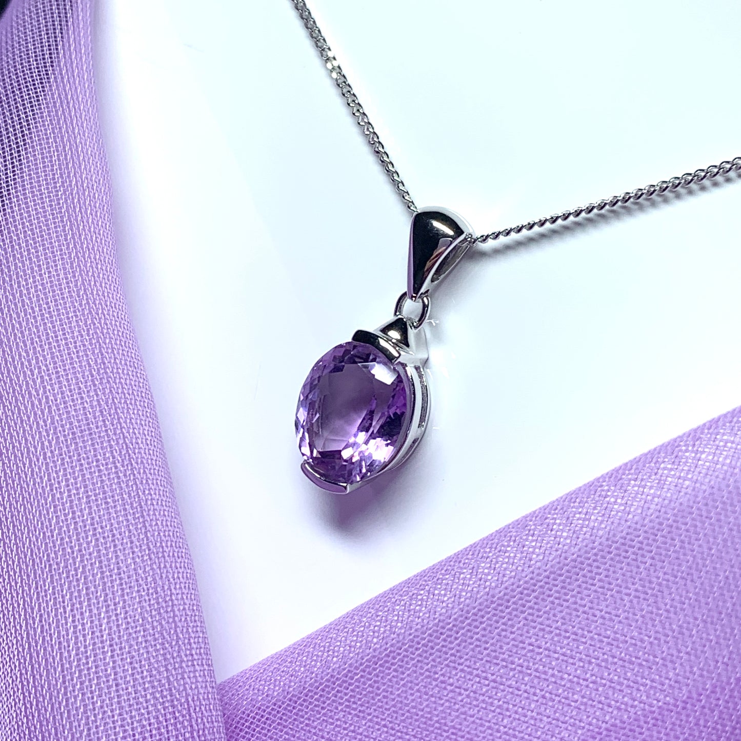 Large oval shaped purple amethyst white gold necklace