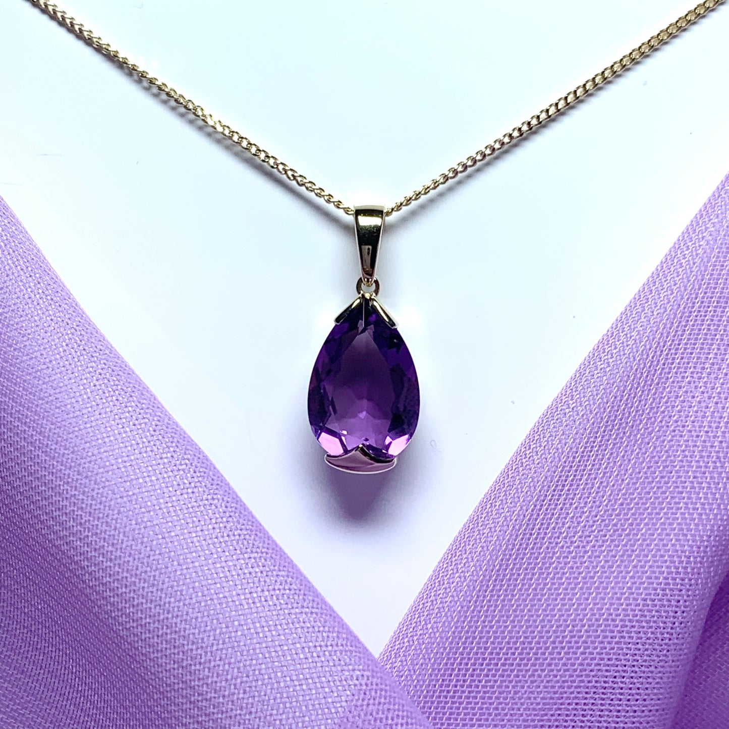 Large pear shaped purple amethyst yellow gold necklace