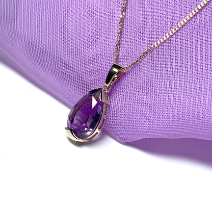 Large pear shaped purple amethyst yellow gold necklace