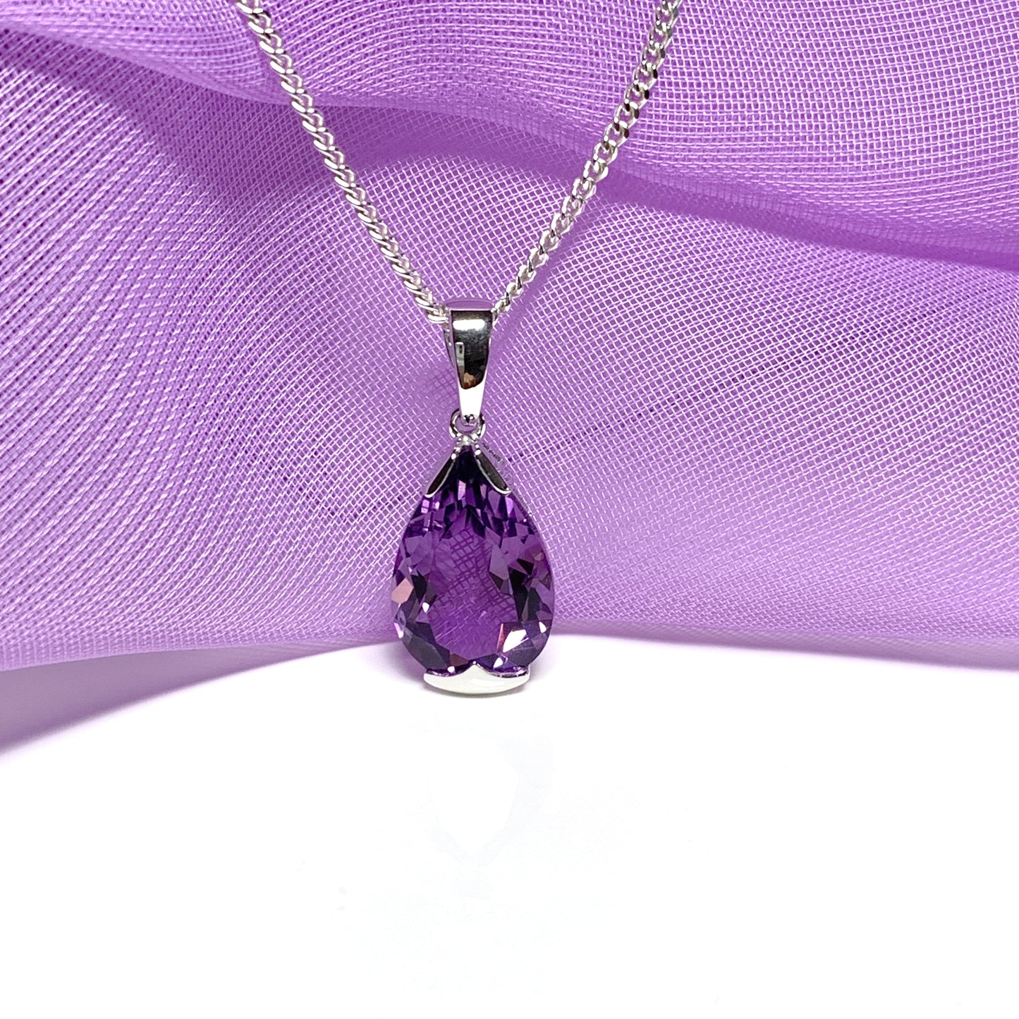 Large pear shaped purple amethyst white gold necklace, a stunning pendant