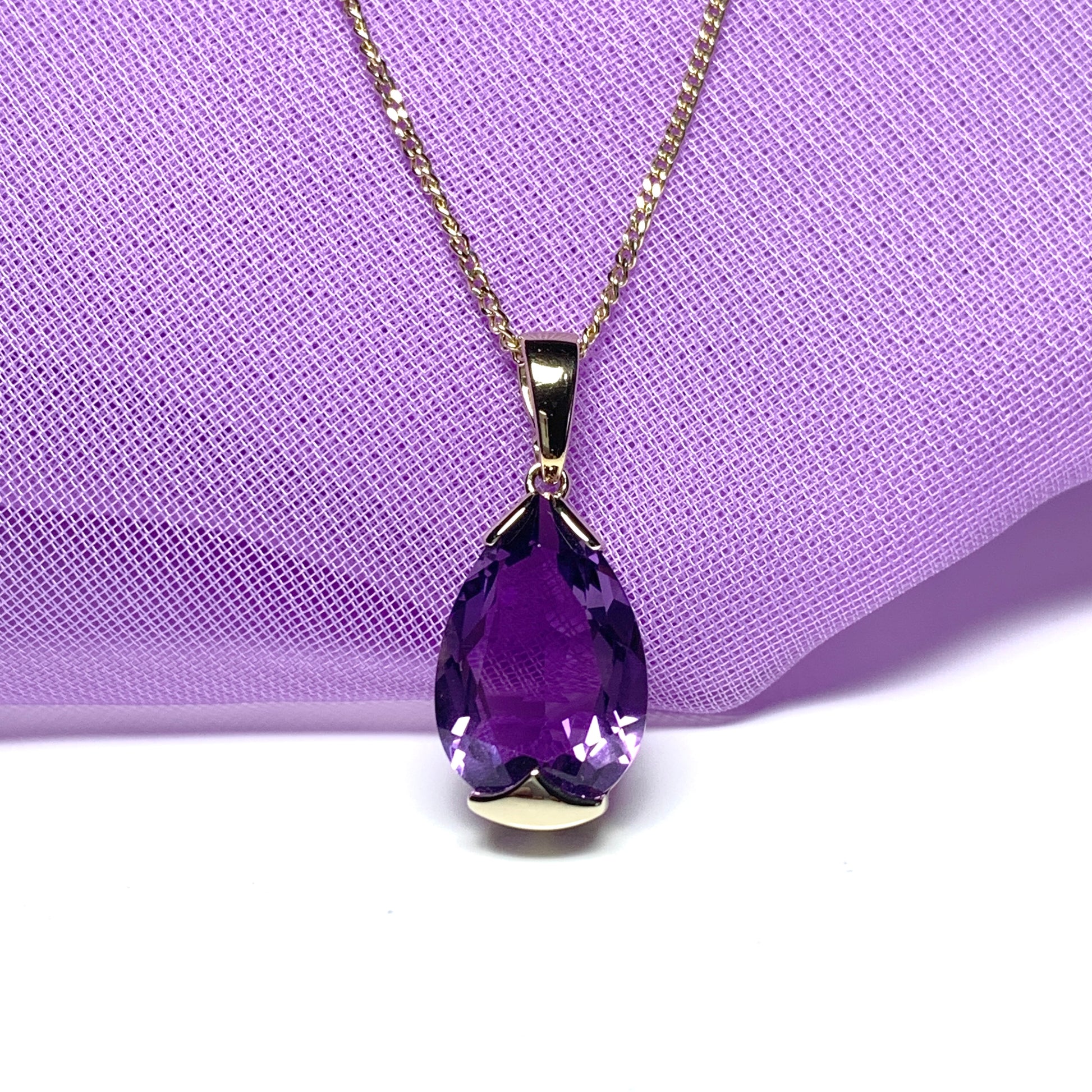 Large pear shaped purple amethyst yellow gold necklace