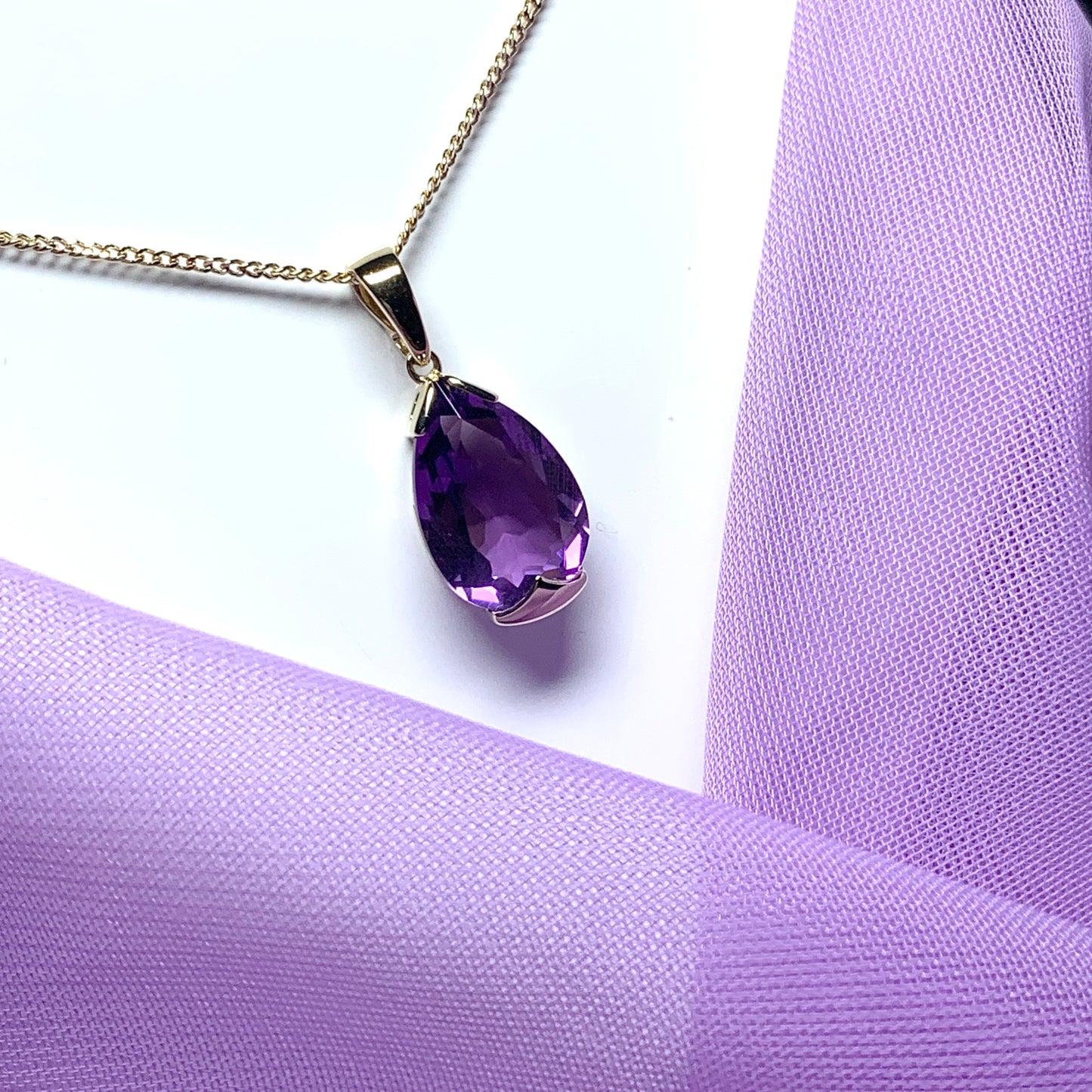 Large pear shaped purple amethyst yellow gold necklace