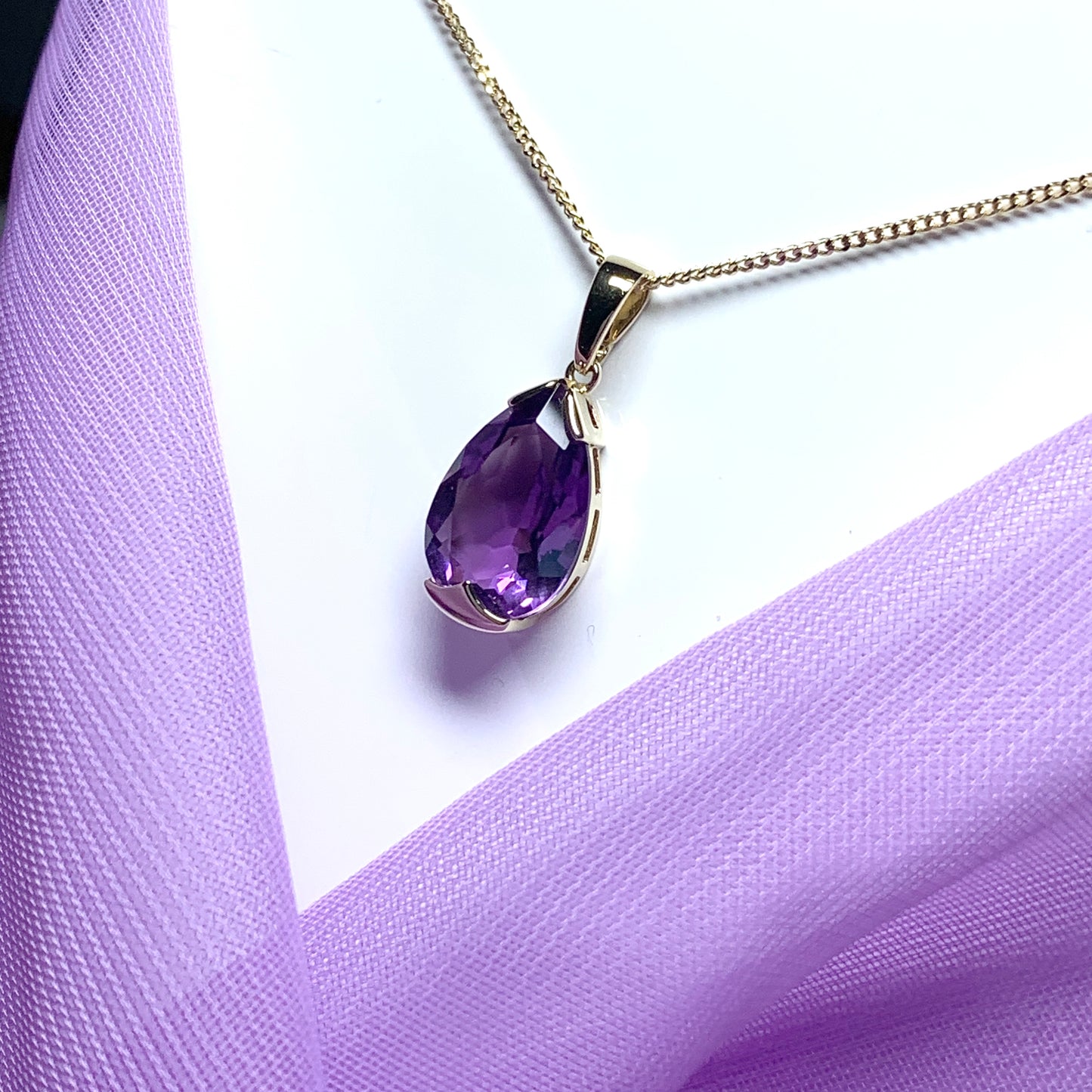 Large pear shaped purple amethyst yellow gold necklace