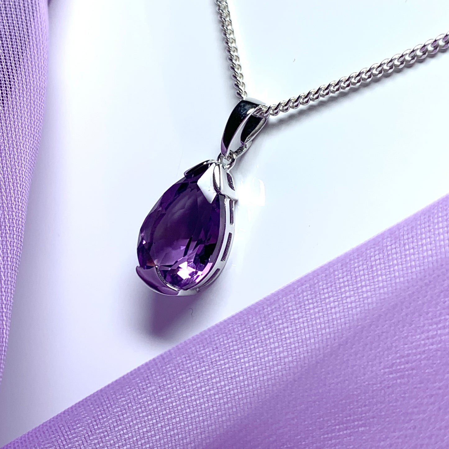 Large pear shaped purple amethyst white gold necklace