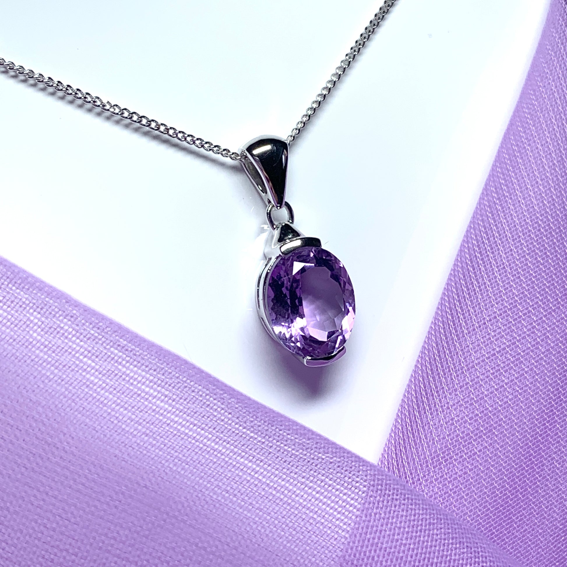 Large oval shaped purple amethyst white gold necklace