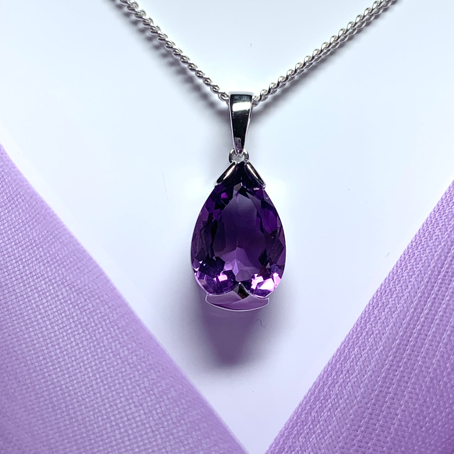 Large pear shaped purple amethyst white gold necklace