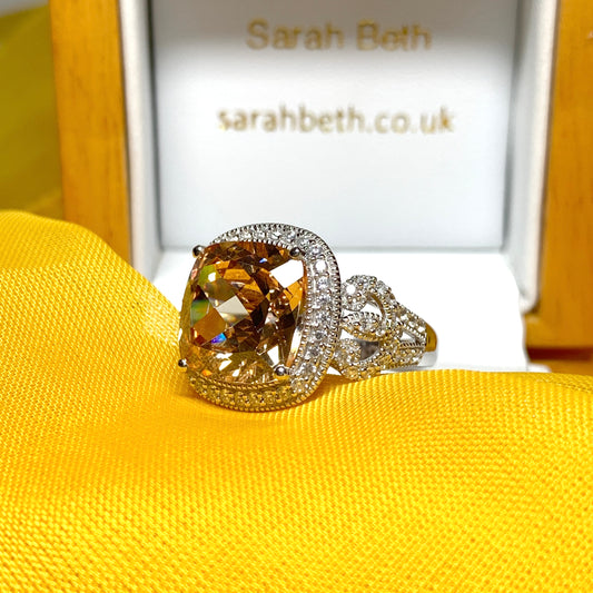 Large topaz coloured cocktail ring with decorated shoulders
