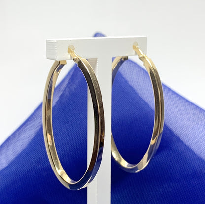 Yellow gold large oval hoop earrings plain polished