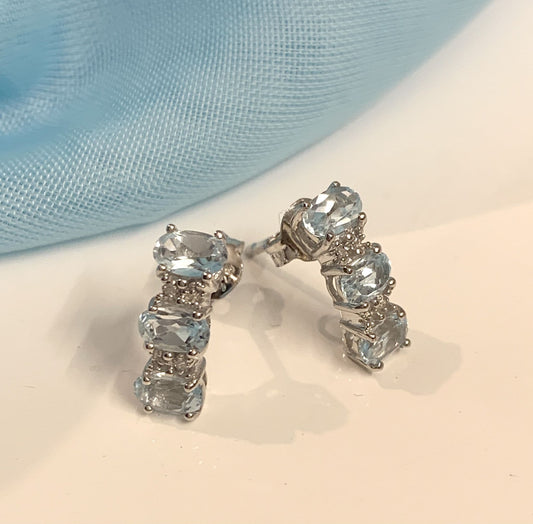 Light Blue Topaz And Diamond Curved Sterling Silver Stud Earrings