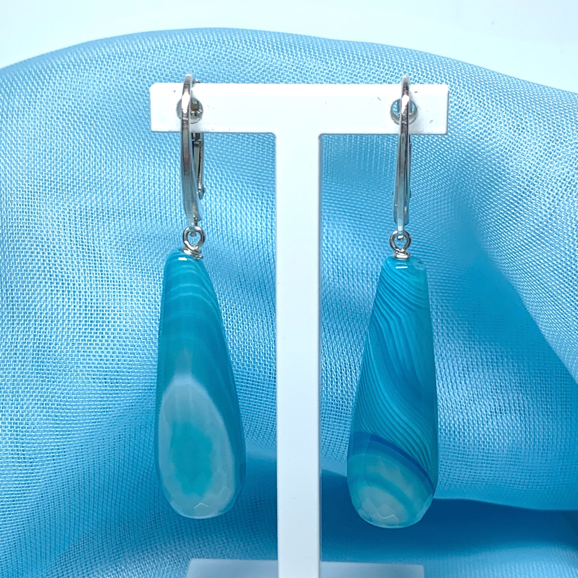 Light blue teardrop shaped long drop agate earrings