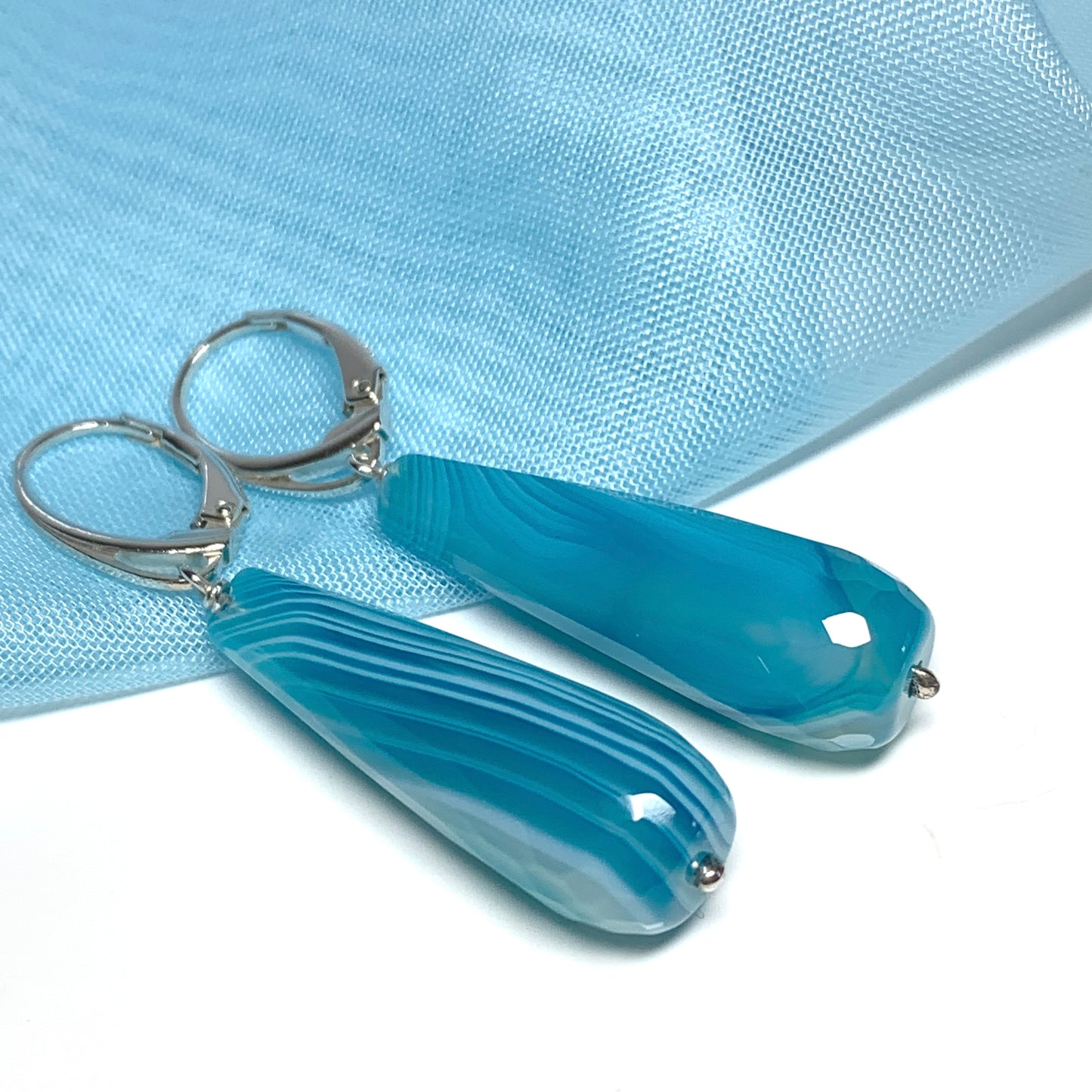 Light blue teardrop shaped long drop agate earrings
