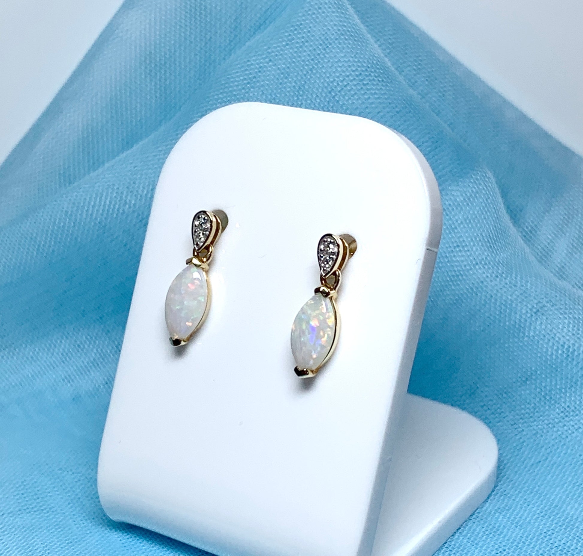 Marquise shaped opal and diamond yellow gold drop earrings