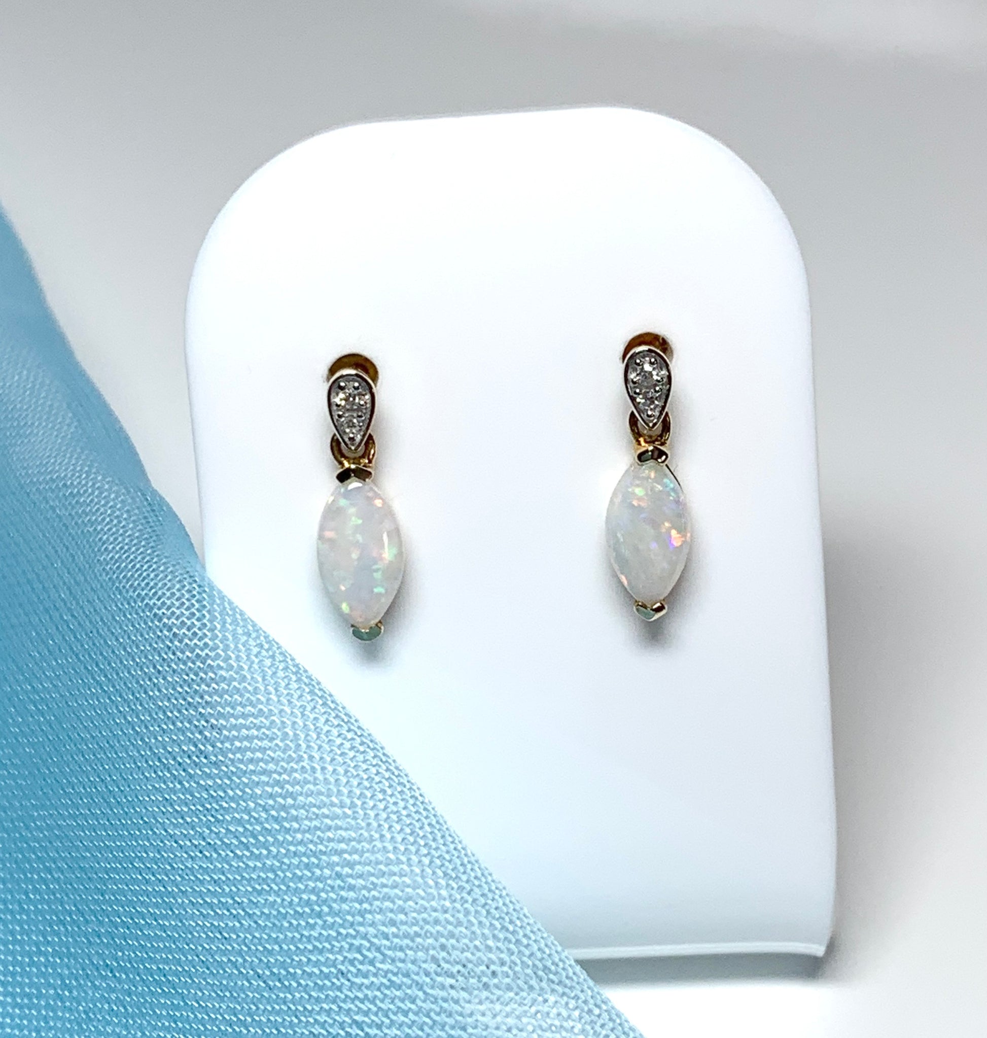 Marquise shaped opal and diamond yellow gold drop earrings