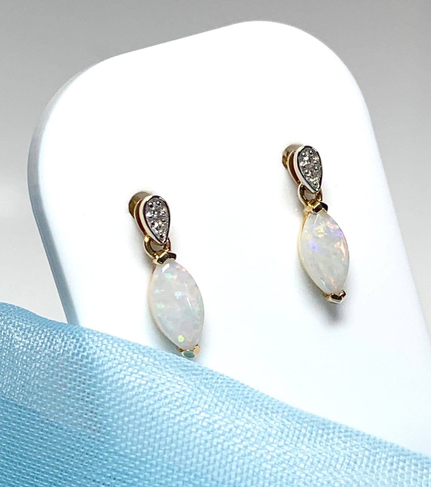 Marquise shaped opal and diamond yellow gold drop earrings