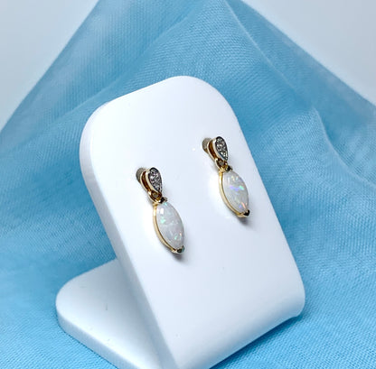 Marquise shaped opal and diamond yellow gold drop earrings