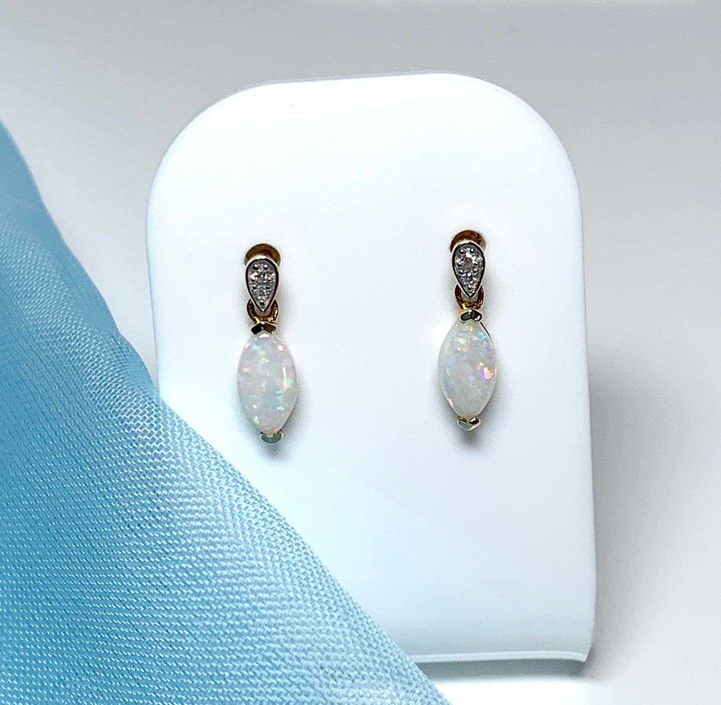 Marquise shaped opal and diamond yellow gold drop earrings