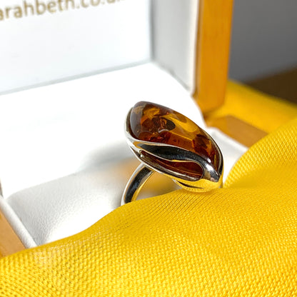 Marquise shaped sterling silver real amber ring