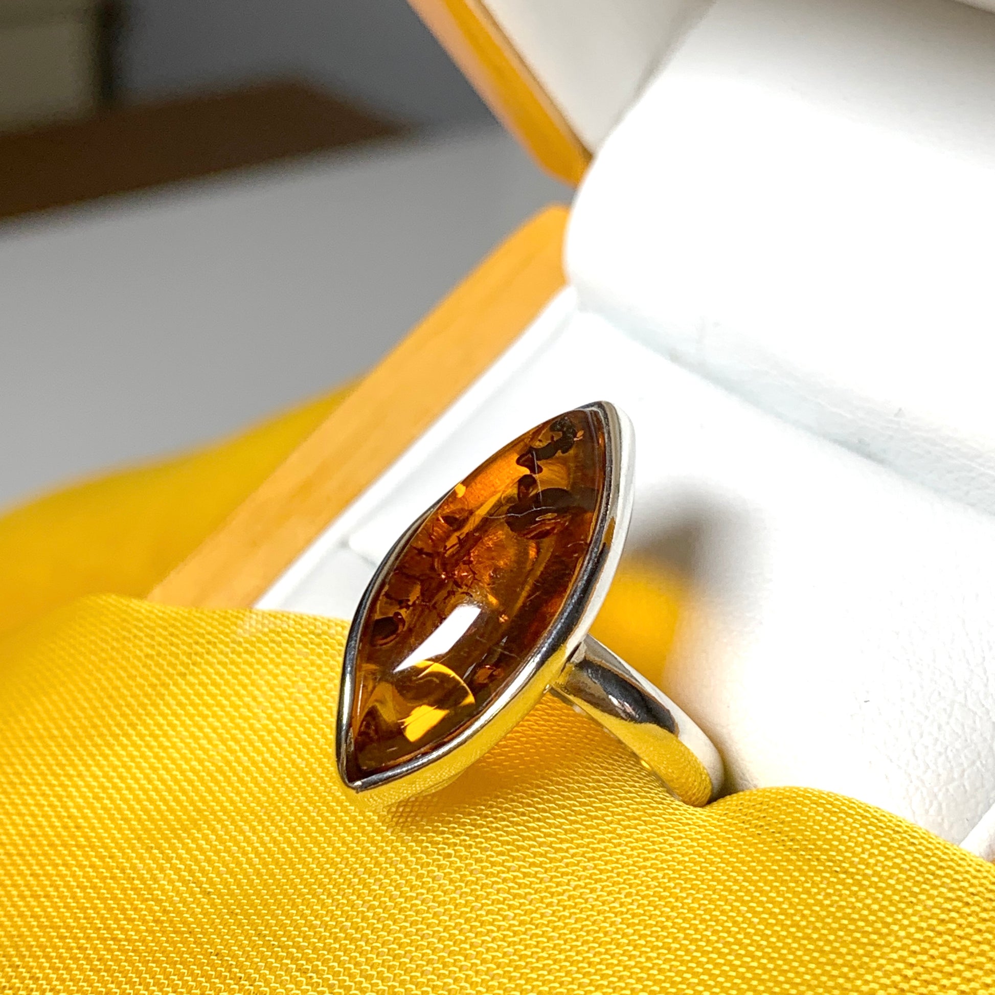 Marquise shaped sterling silver real amber ring