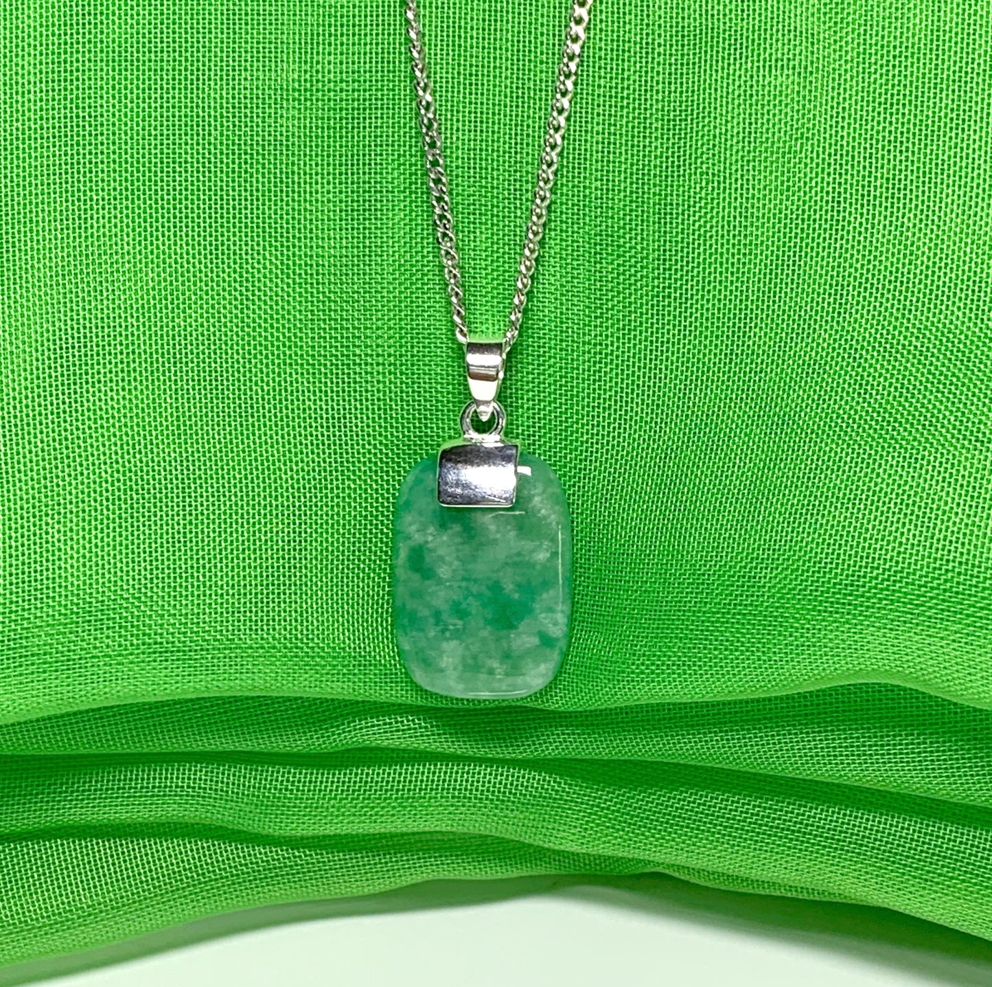 Mottled necklace with real green jade sterling silver cushion shaped pendant