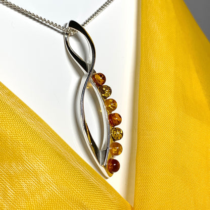 Multi colour amber figure of eight drop sterling silver necklace