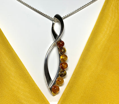 Multi colour amber figure of eight drop sterling silver necklace