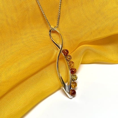 Multi colour amber figure of eight drop sterling silver necklace