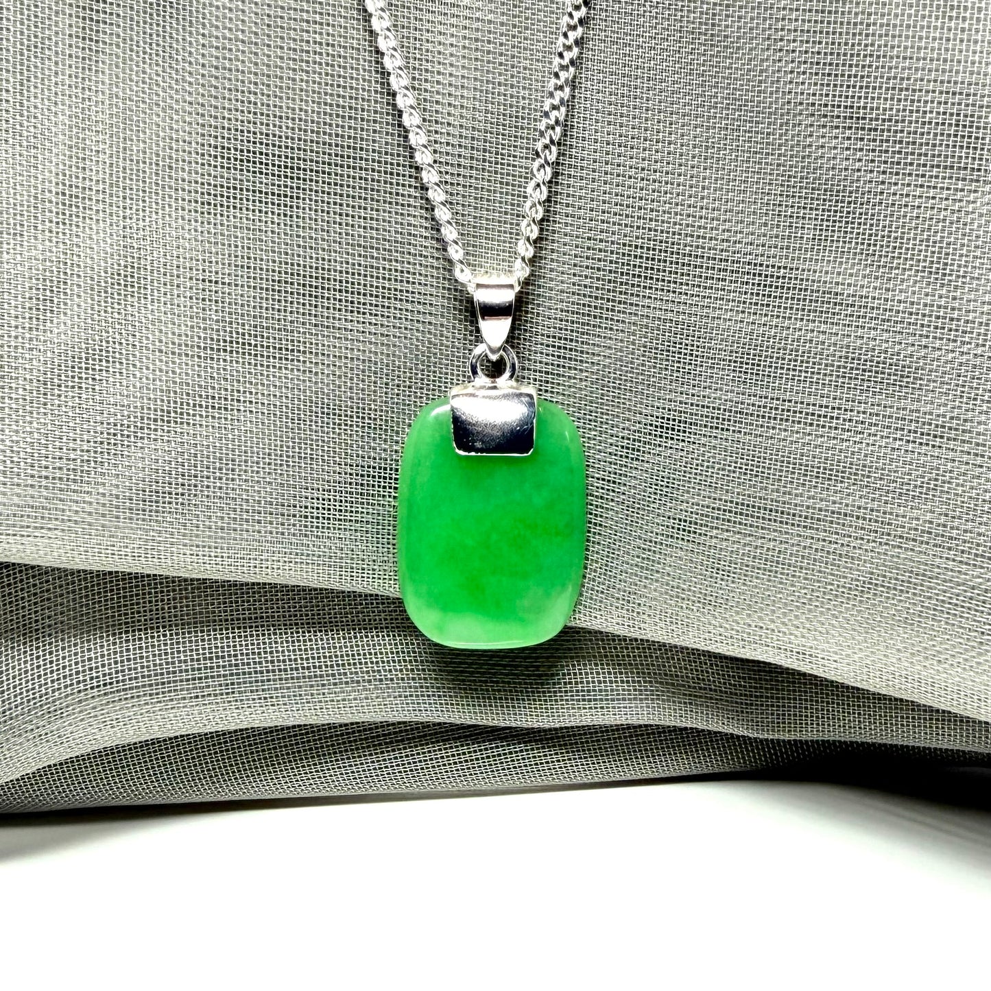 Necklace pendant having real green jade sterling silver cushion shape, stunning