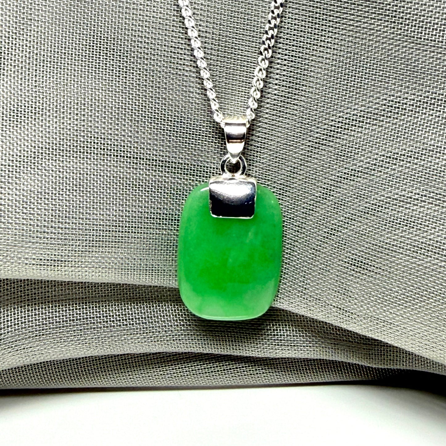 Necklace pendant having real green jade sterling silver cushion shape, stunning