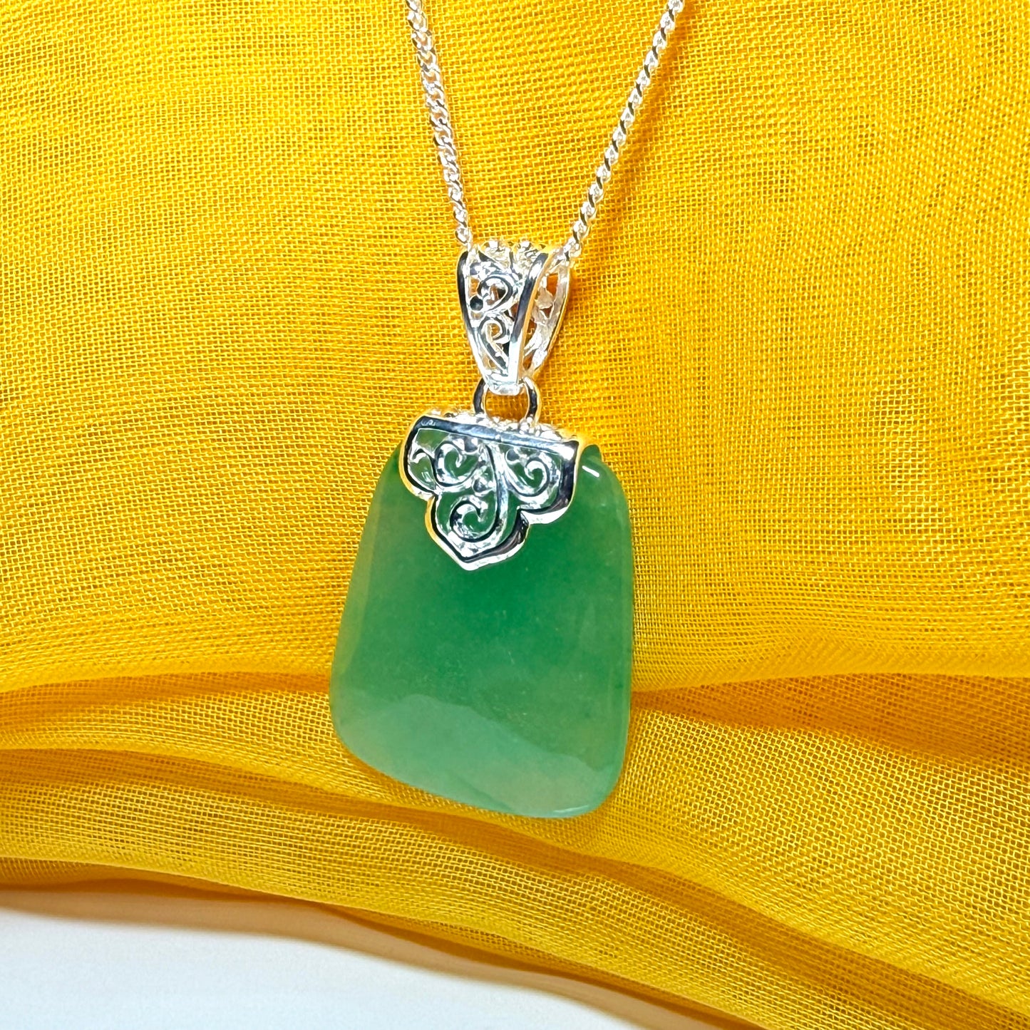 Necklace with a real green jade stone, large necklace cushion shaped, a timeless designed pendant with solid chain included as well