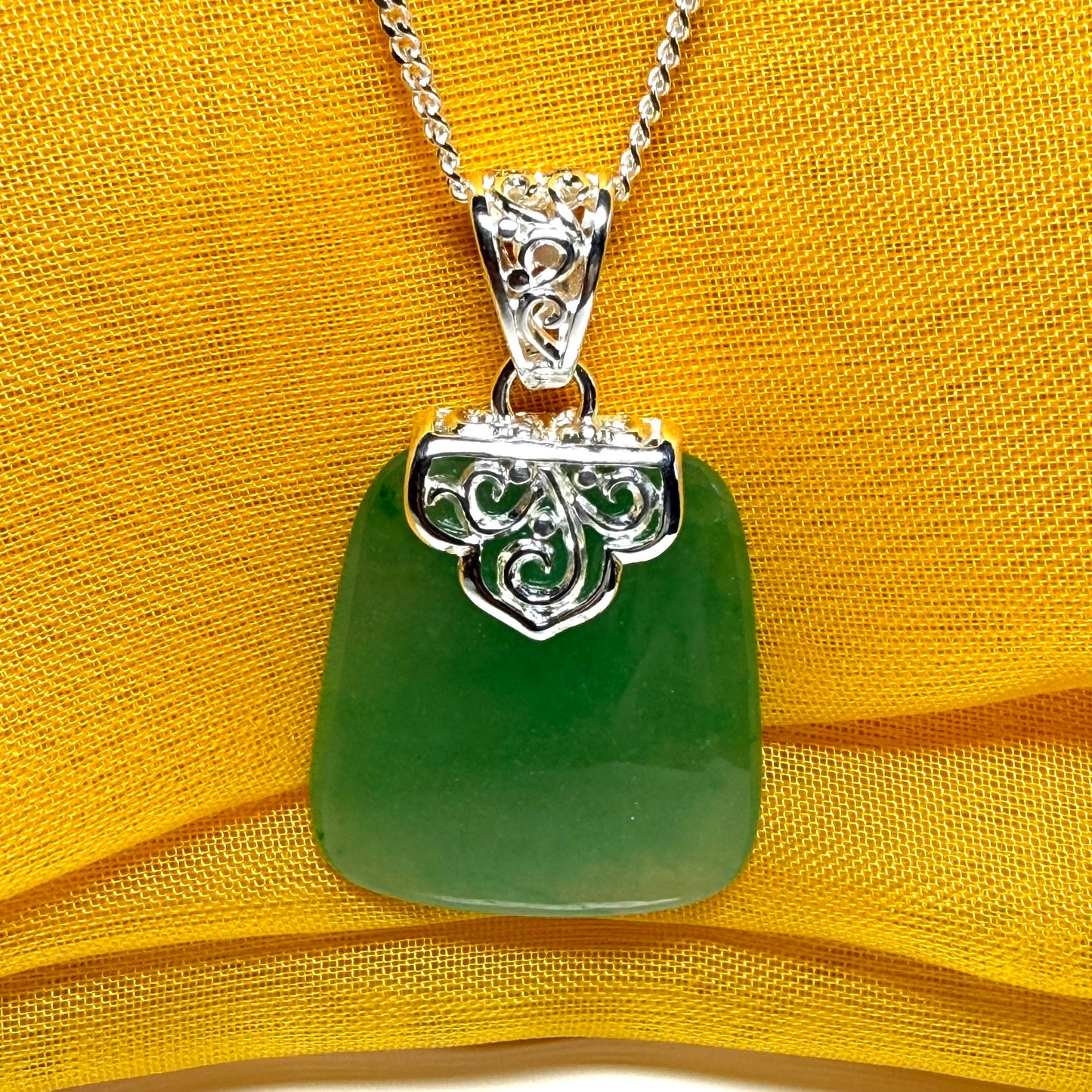 Necklace with a real green jade stone, large necklace cushion shaped, a timeless designed pendant with solid chain included as well