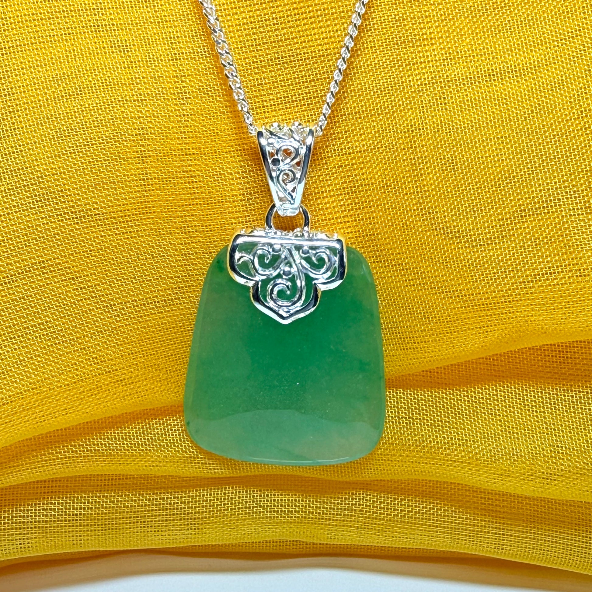 Necklace with a real green jade stone, large necklace cushion shaped, a timeless designed pendant with solid chain included as well