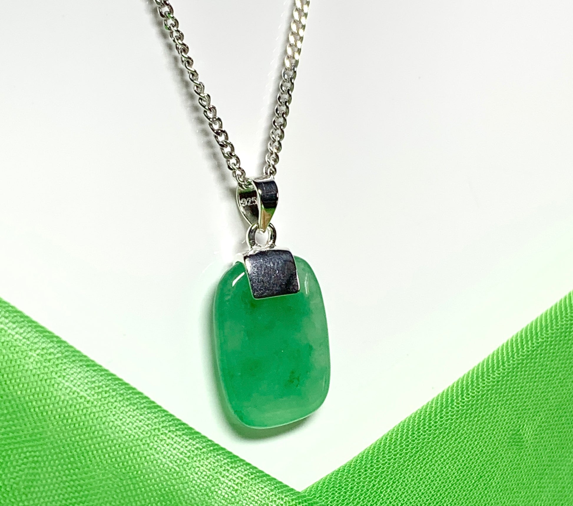 Pendant necklace having a real green jade sterling silver cushion shape