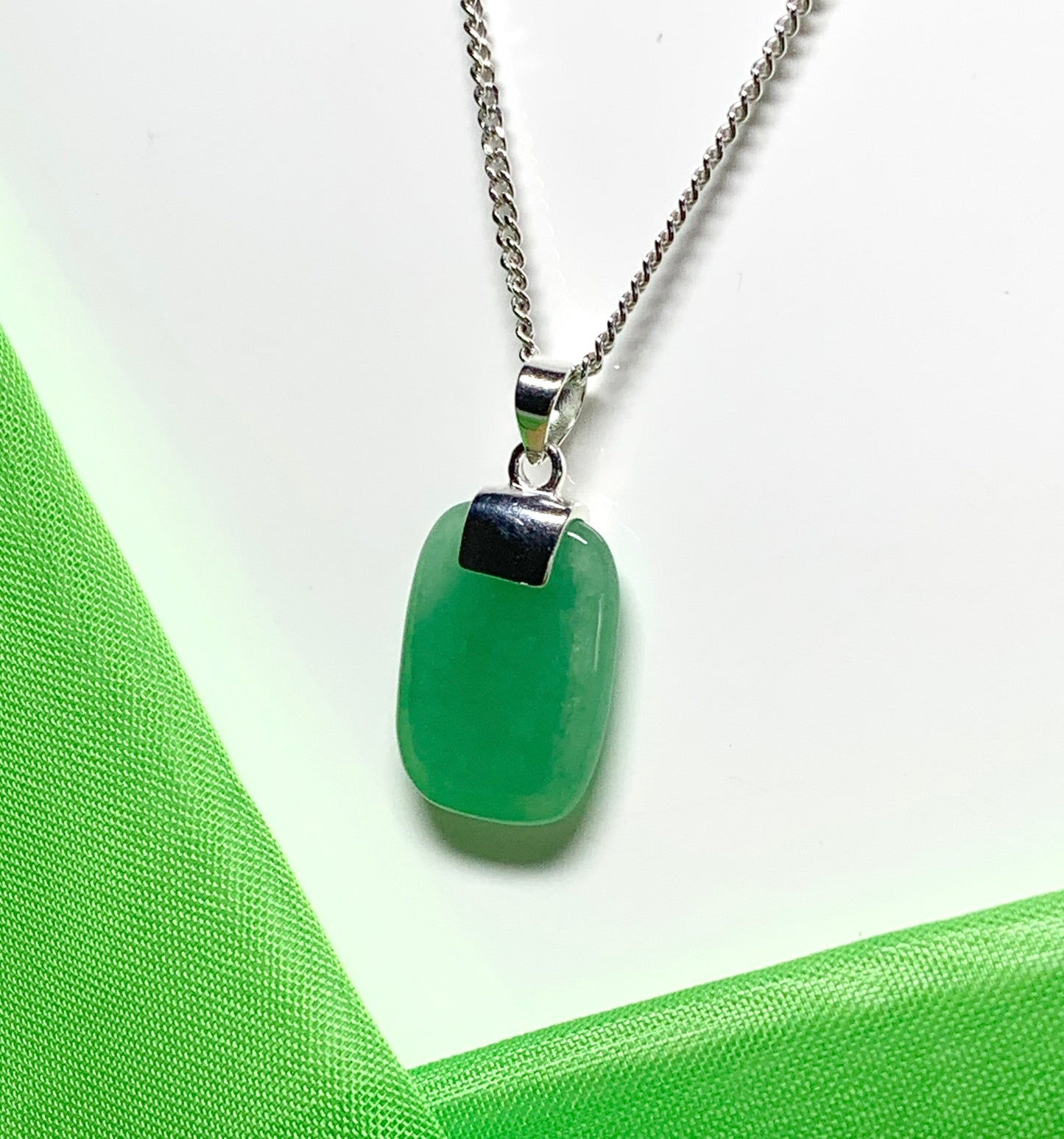 Necklace pendant having a real green jade sterling silver cushion shaped