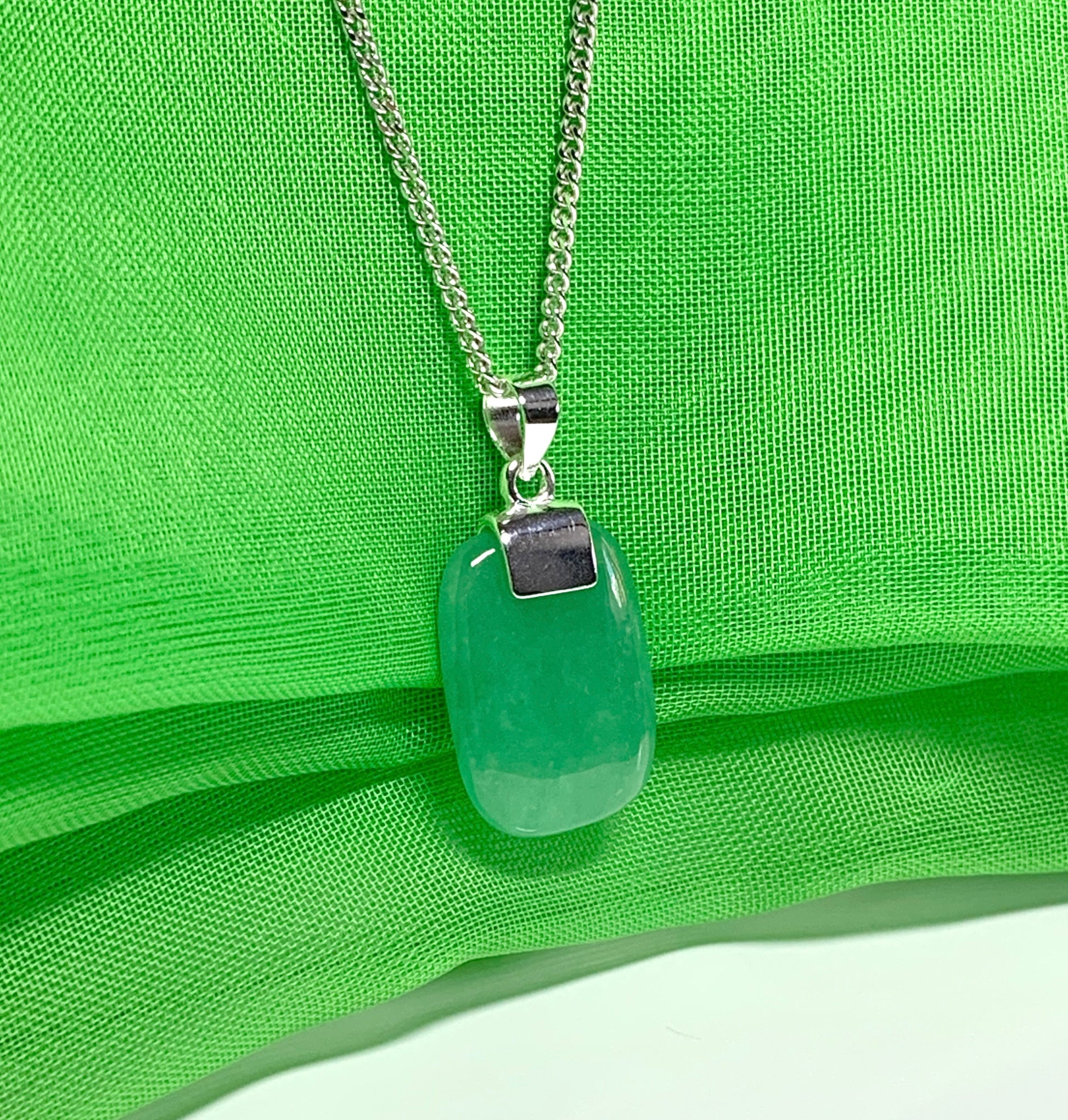 Necklace pendant having a real green jade sterling silver cushion shaped