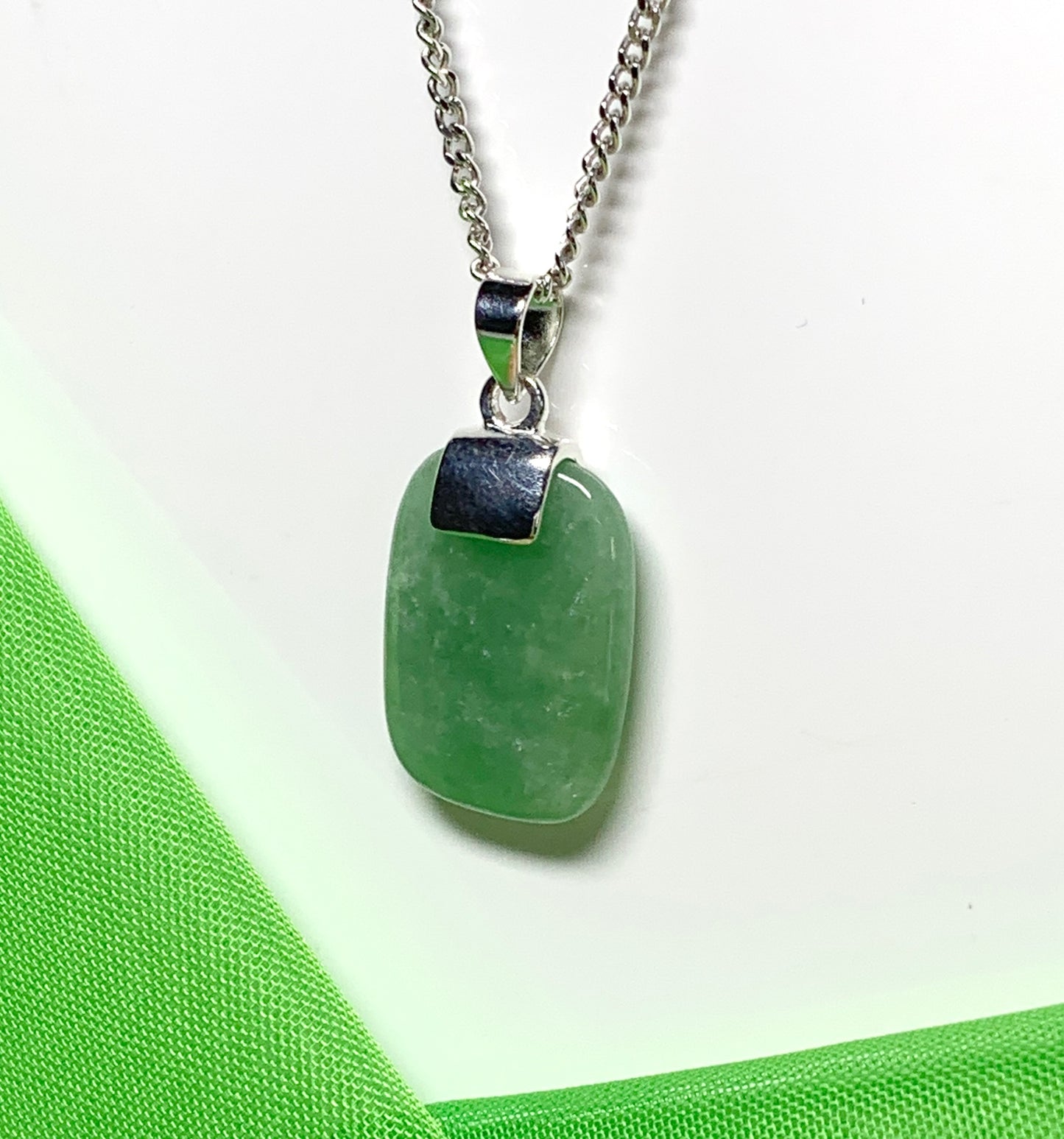 Pendant necklace with a real green jade sterling silver cushion shaped