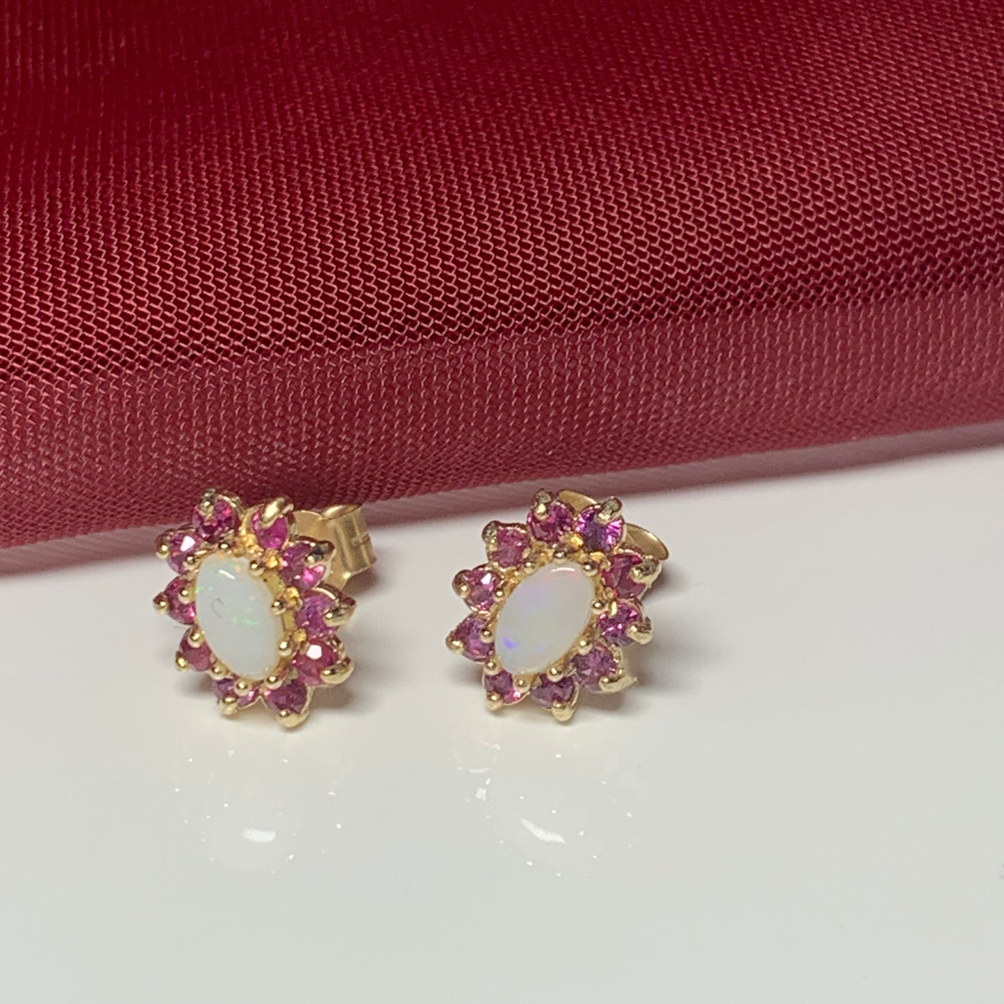 Opal and real ruby oval cluster stud earrings yellow gold