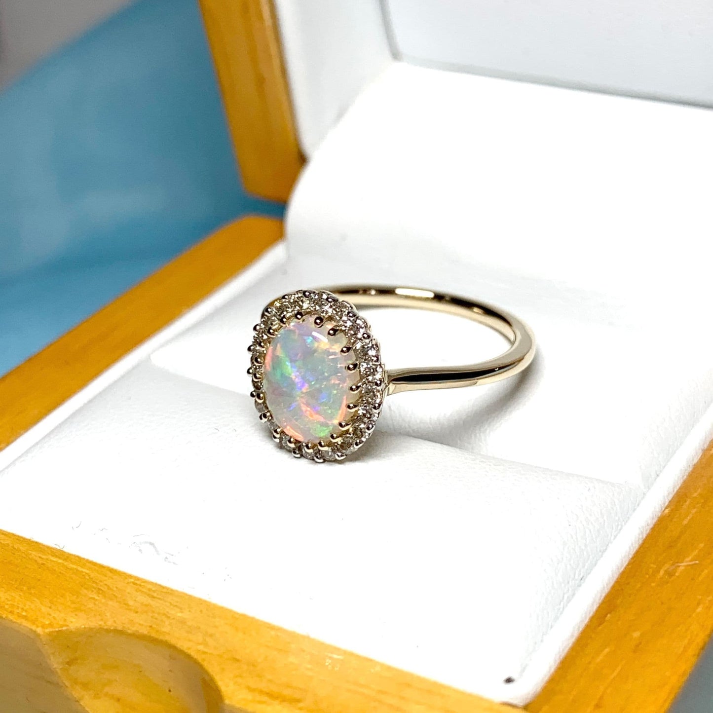 Opal oval and diamond yellow gold cluster ring