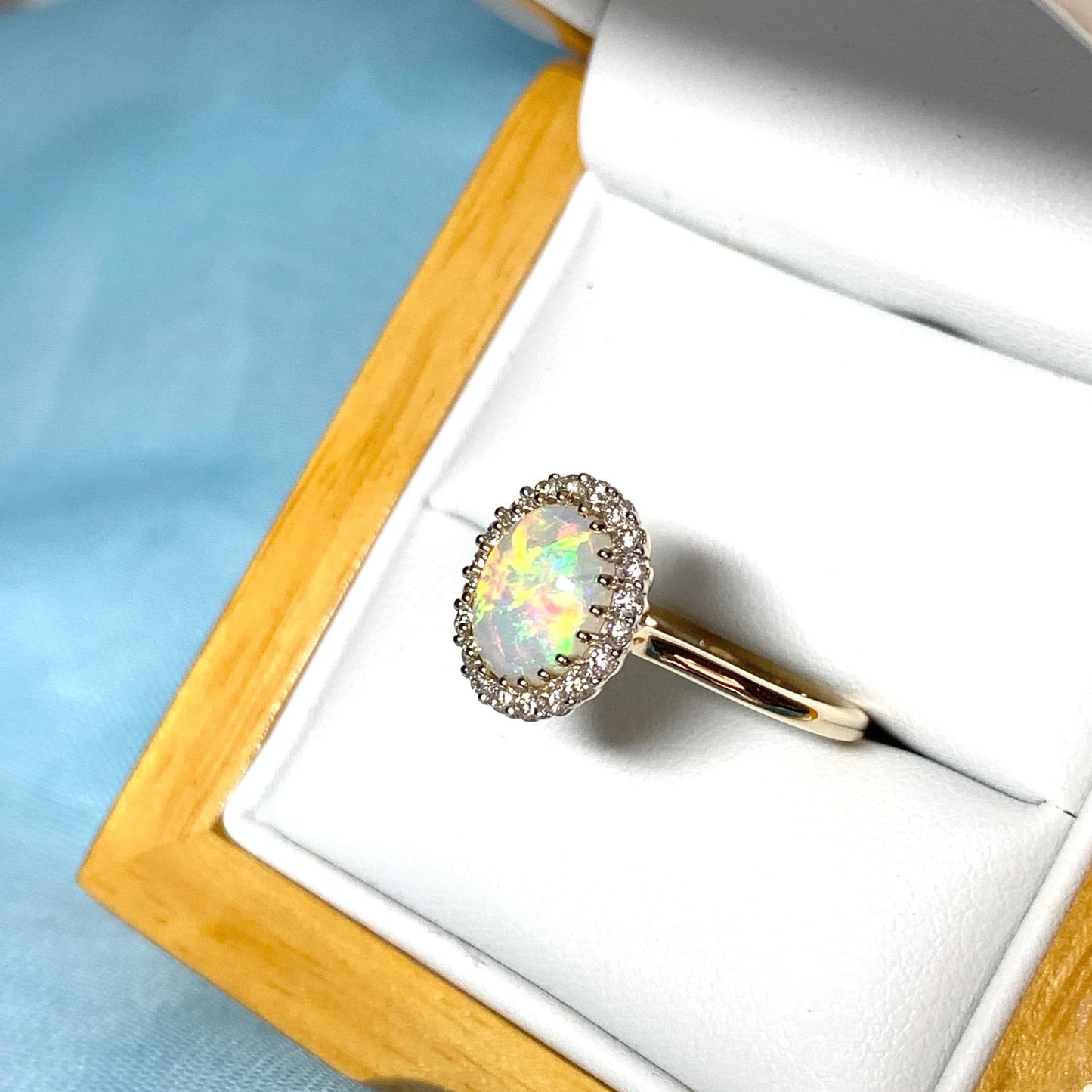 Opal oval and diamond yellow gold cluster ring