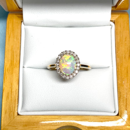 Opal oval and diamond yellow gold cluster ring