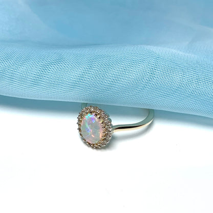 Opal oval and diamond yellow gold cluster ring