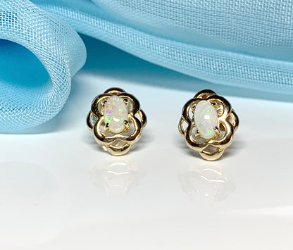 Opal yellow gold emerald stud earrings oval shaped scroll design