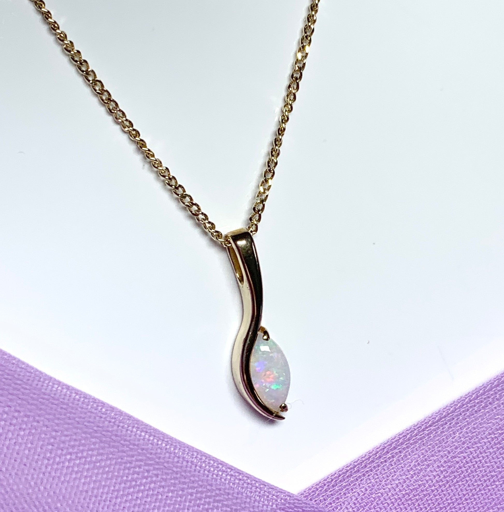 Opal yellow gold oval marquise shaped pendant necklace