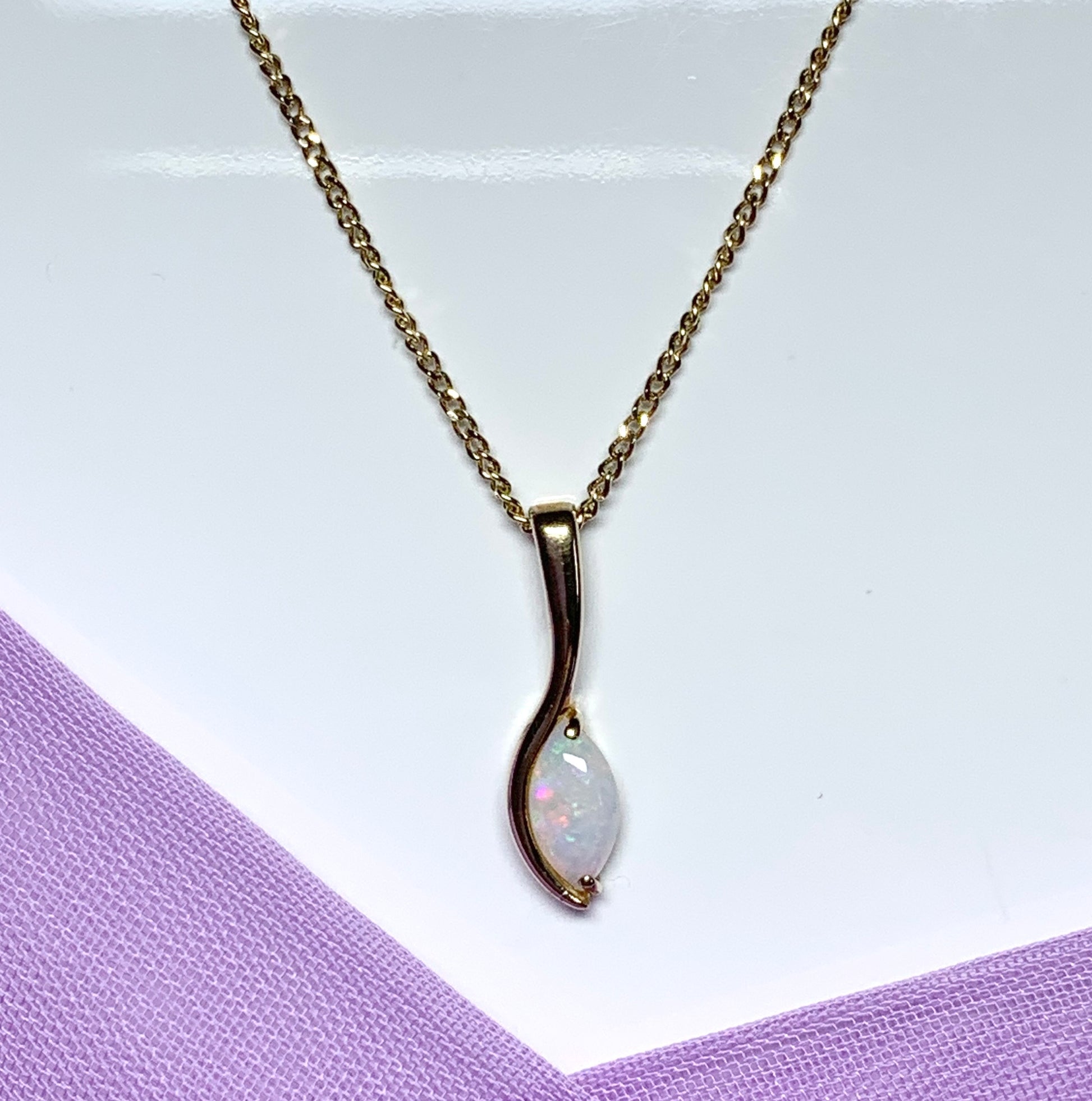 Opal yellow gold oval marquise shaped pendant necklace