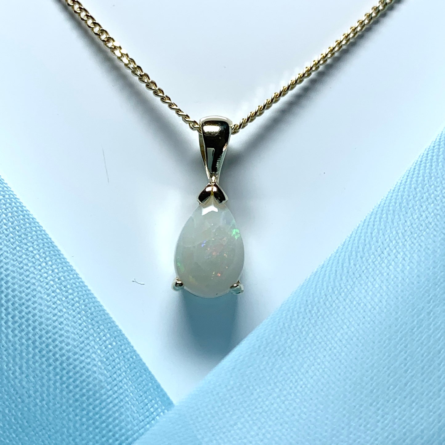Opal yellow gold pear shaped necklace