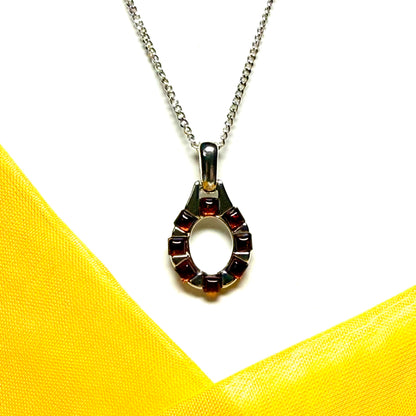 Open oval amber necklace sterling silver pendant