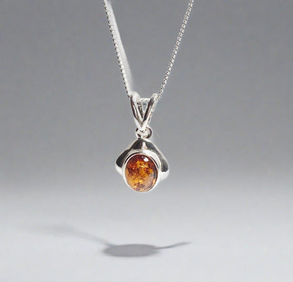 Orange amber oval cushion sterling silver necklace