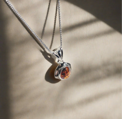 Orange amber oval cushion sterling silver necklace