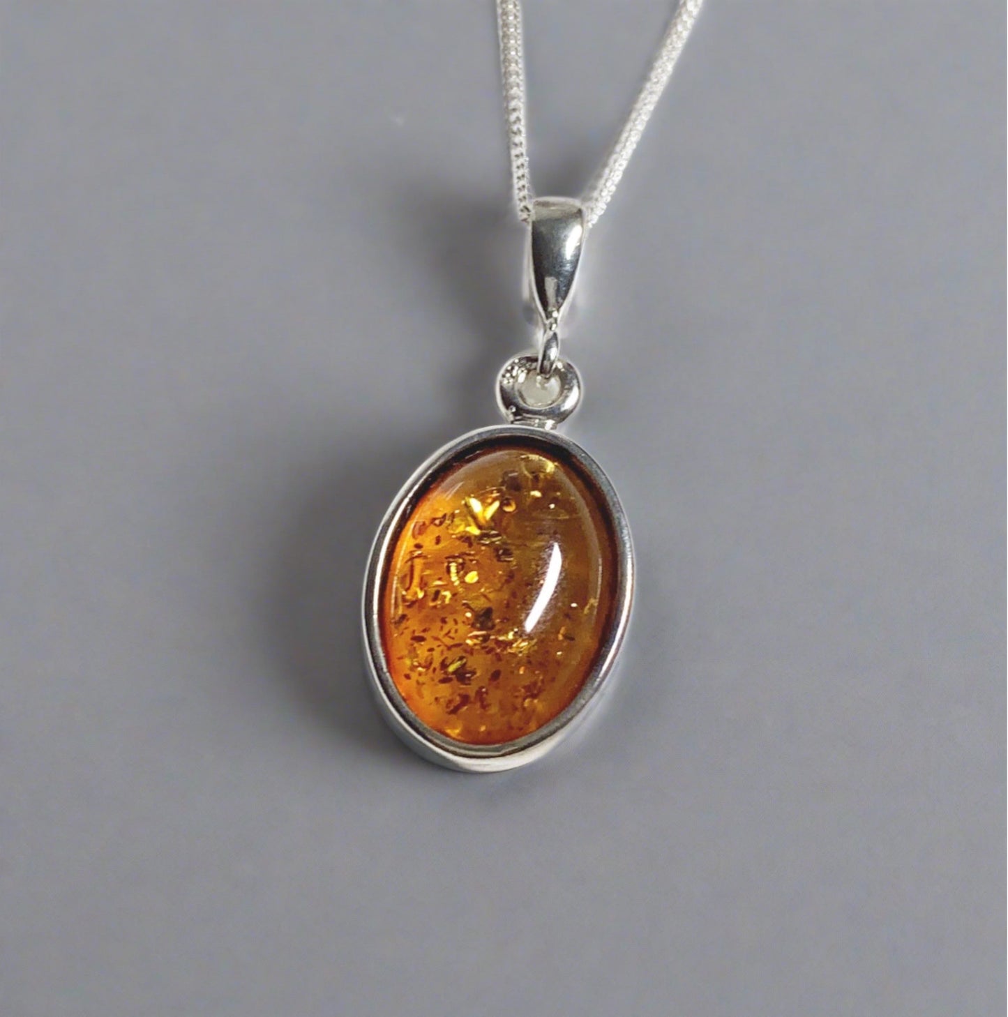 Orange amber oval sterling silver necklace