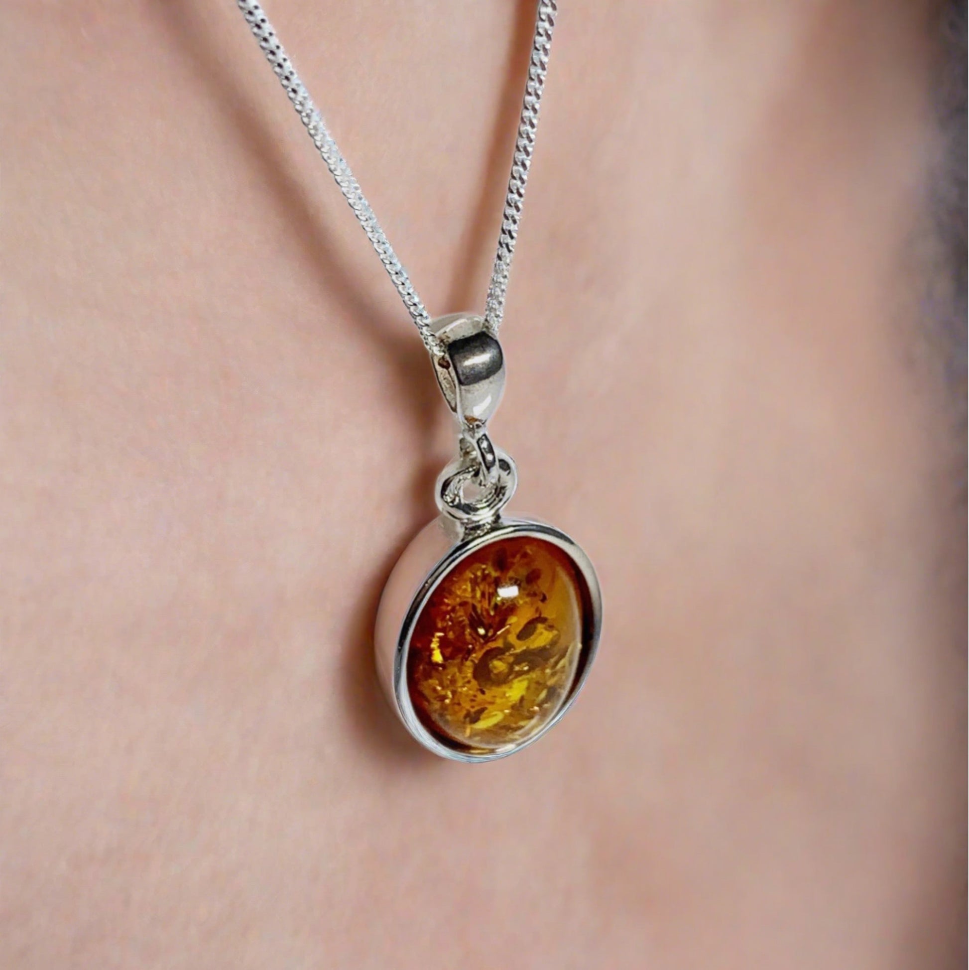 Orange amber oval sterling silver necklace