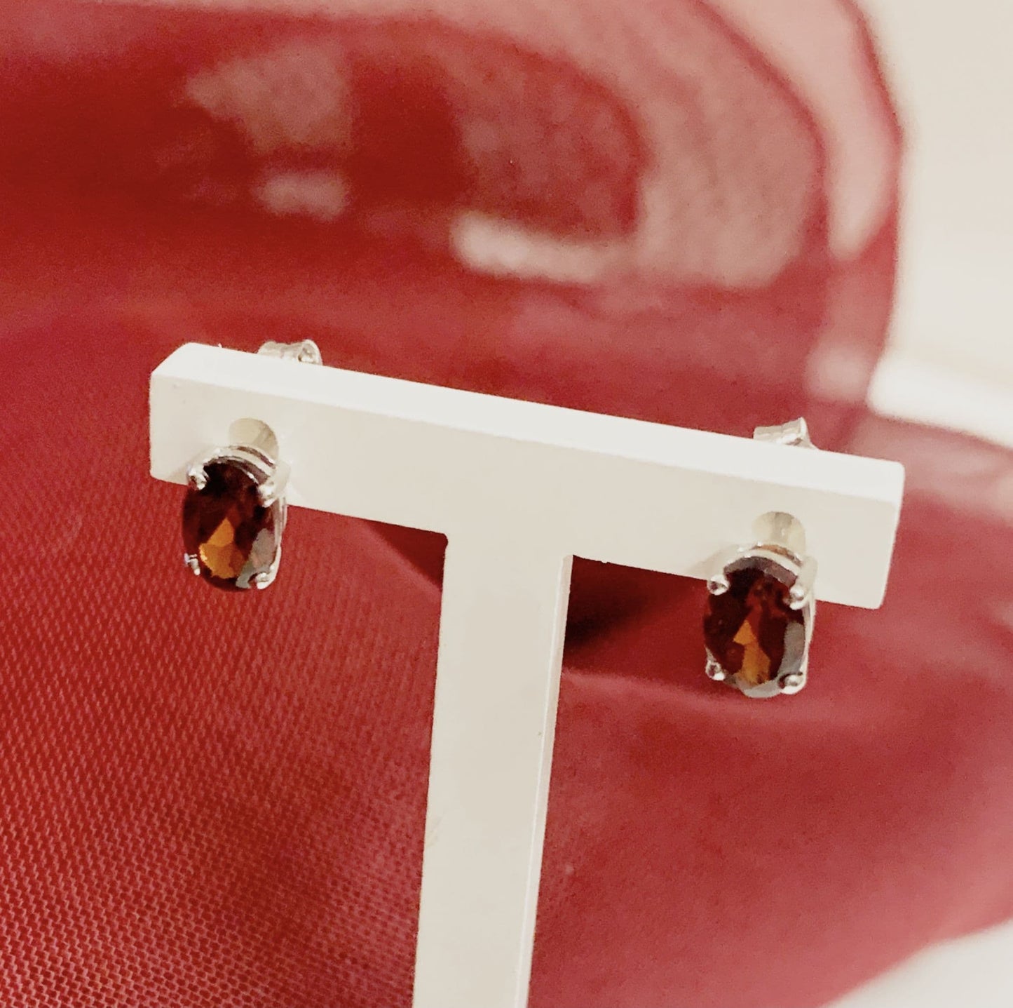 Oval garnet white gold stud earrings